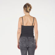 a woman wearing a black Ridge Merino Wool Cami Tank