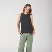 a woman wearing a black Canopy Tank Top with green cargo pants