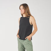 a woman wearing a black Canopy Tank Top and green cargo pants