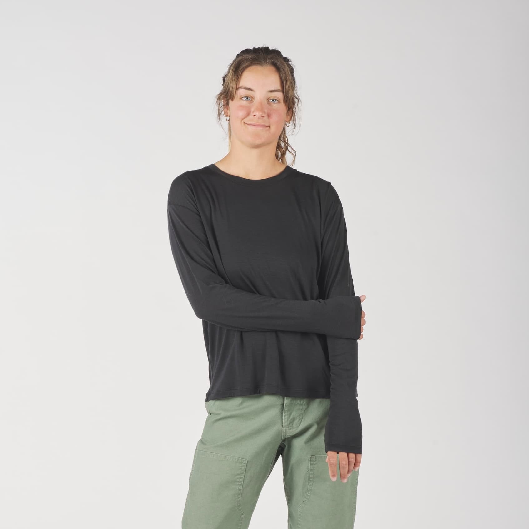 a woman wearing a black Canopy Merino Tencel Long Sleeve Shirt