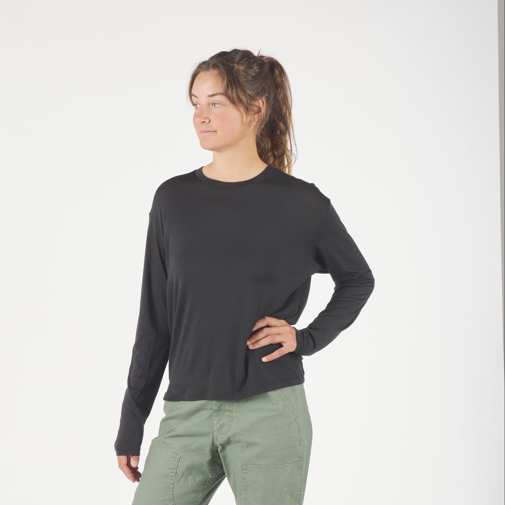 a woman wearing a black Canopy Merino Tencel Long Sleeve Shirt