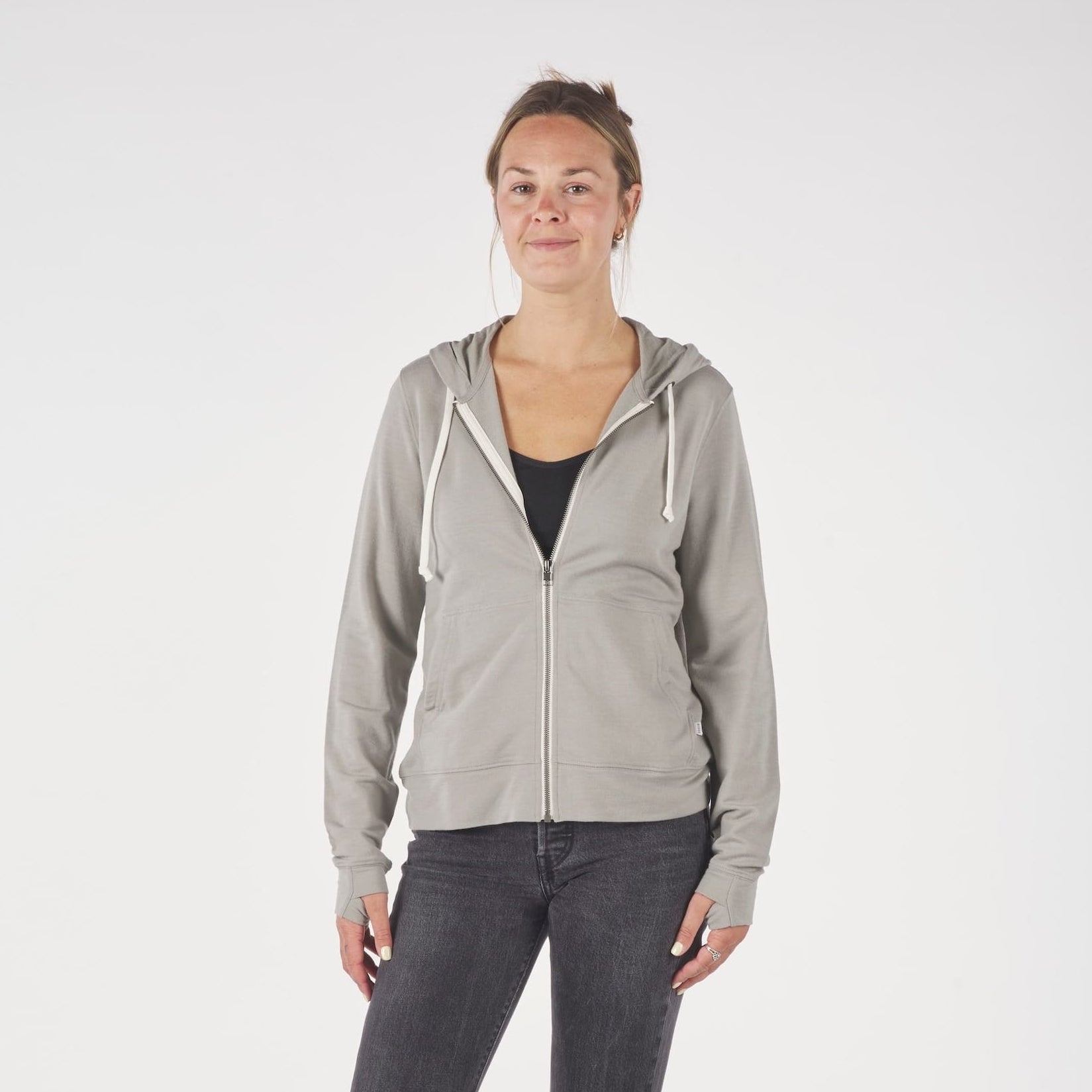 A woman wearing a Rock Ridge Traveler Hoodie