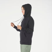 a woman wearing a men's small Ridge Meirno Onsen Hoodie