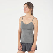 a woman wearing a Gunmetal gray Merino Wool Cami Tank and running shorts