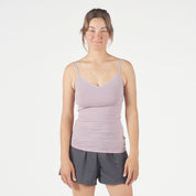 a woman wearing a Dusty Lilac Merino Wool Cami Tank and running shorts