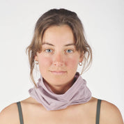 a woman wearing a Sierra Merino Wool Neck Tube in Dusty Lilac with a bralette