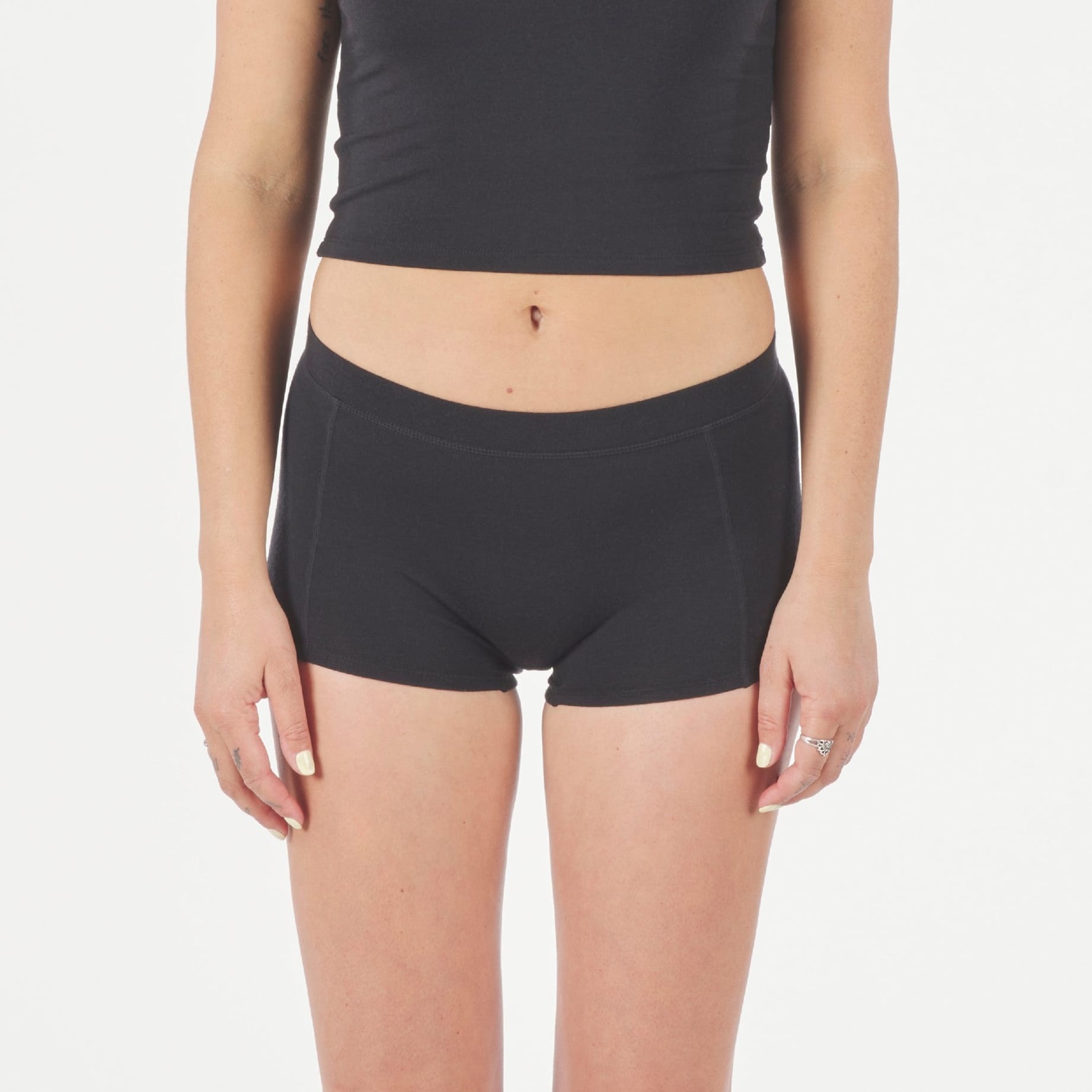 a woman wearing black Ridge Merino Boy Short Underwear with a black Ridge Merino Bralette