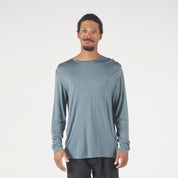 A man wearing a long sleeve Canopy Shirt in Overcast Blue