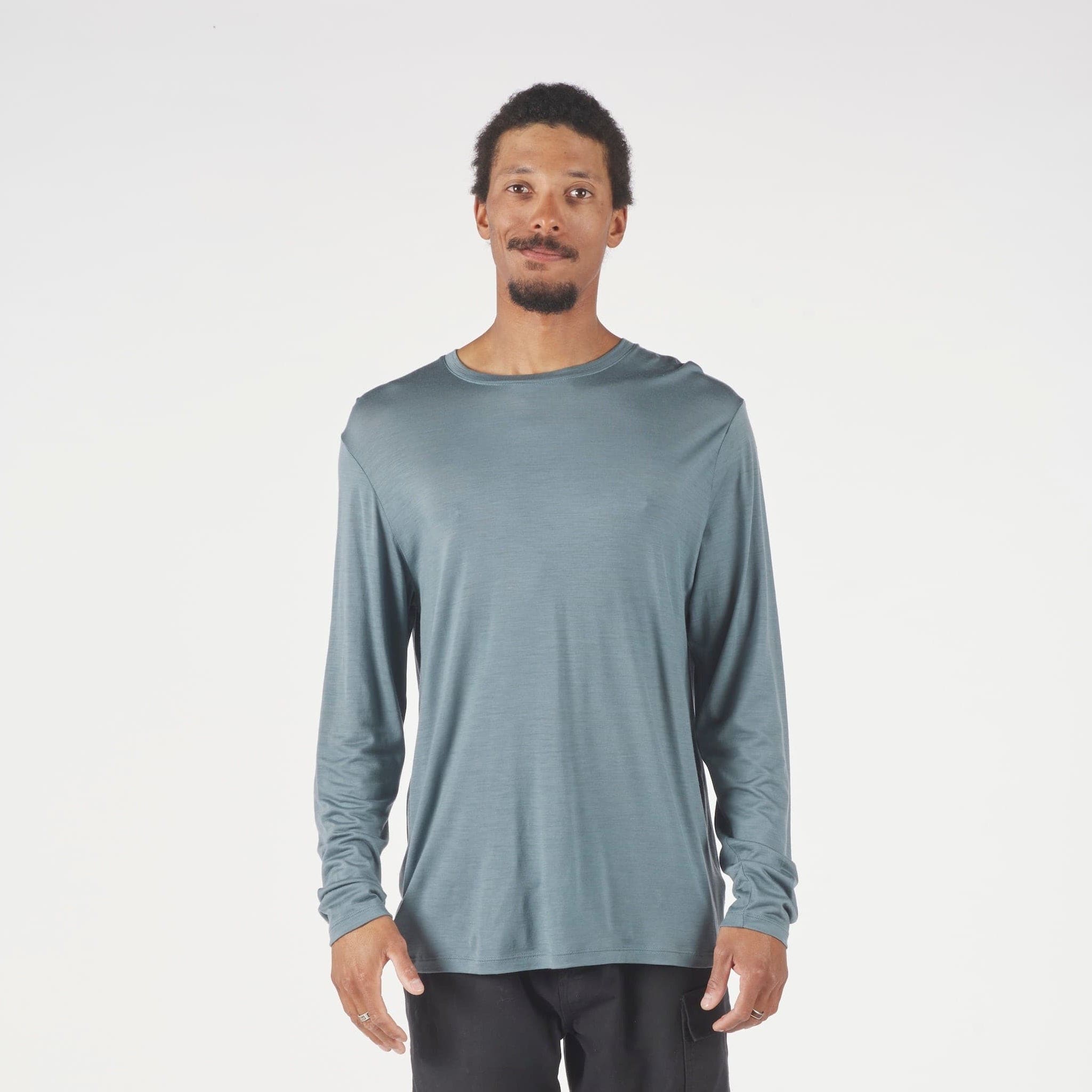 A man wearing a long sleeve Canopy Shirt in Overcast Blue