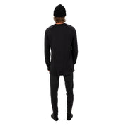 a man wearing Aspect base layers in black from the back