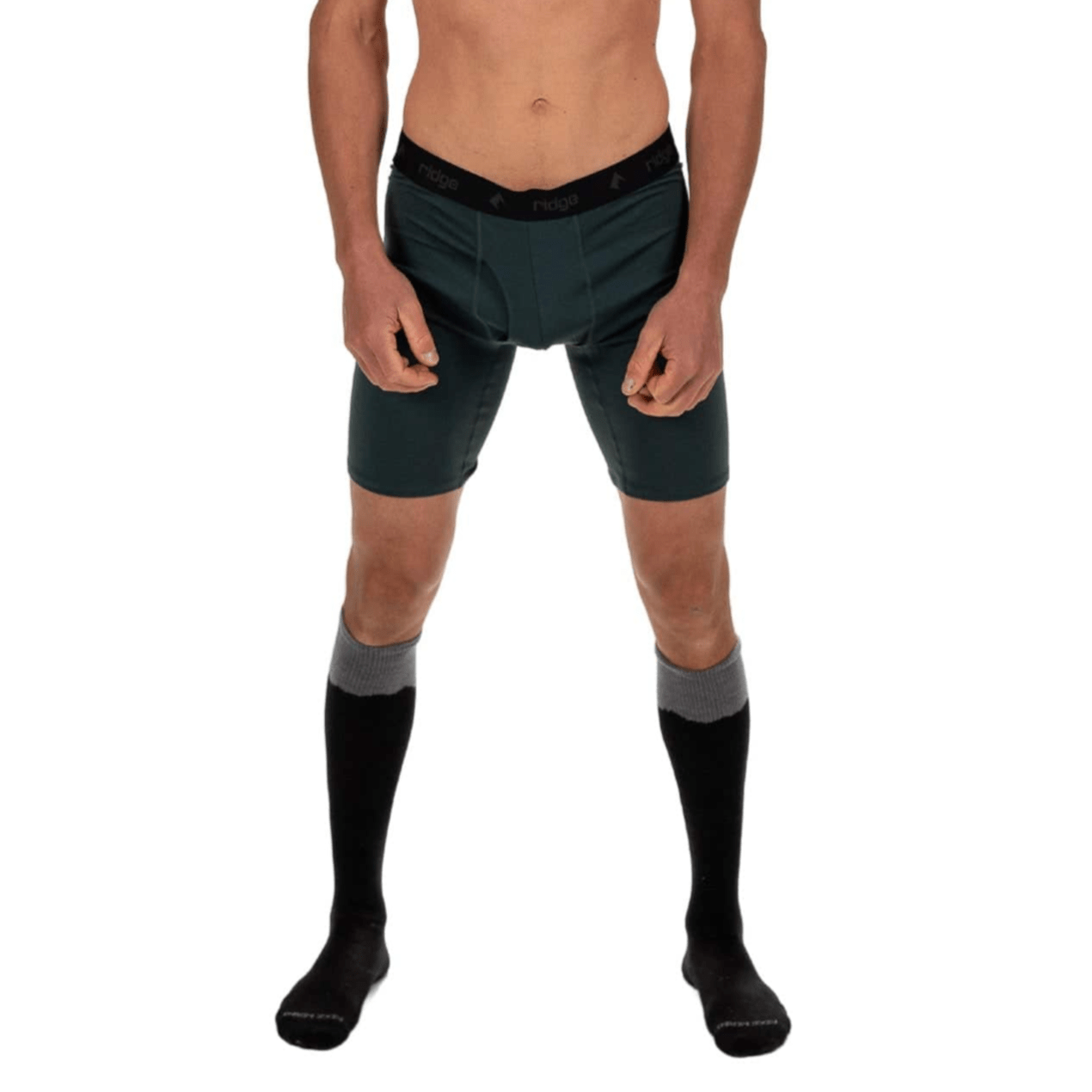 a man wearing Ridge Merino Long Boxer Briefs in Old Growth with Ritter Ski Socks