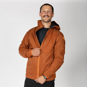 a man wearing an orange Alpha Wool Insulated Jacket with a Merino base layer underneath