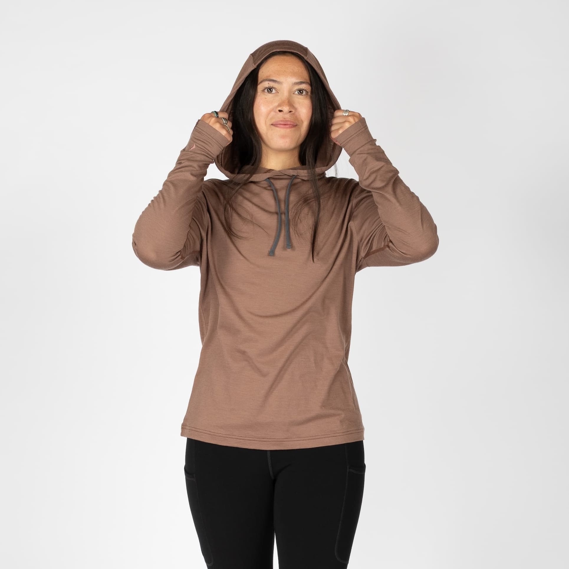 a woman wearing a Nutmeg Solstice Sun Hoodie