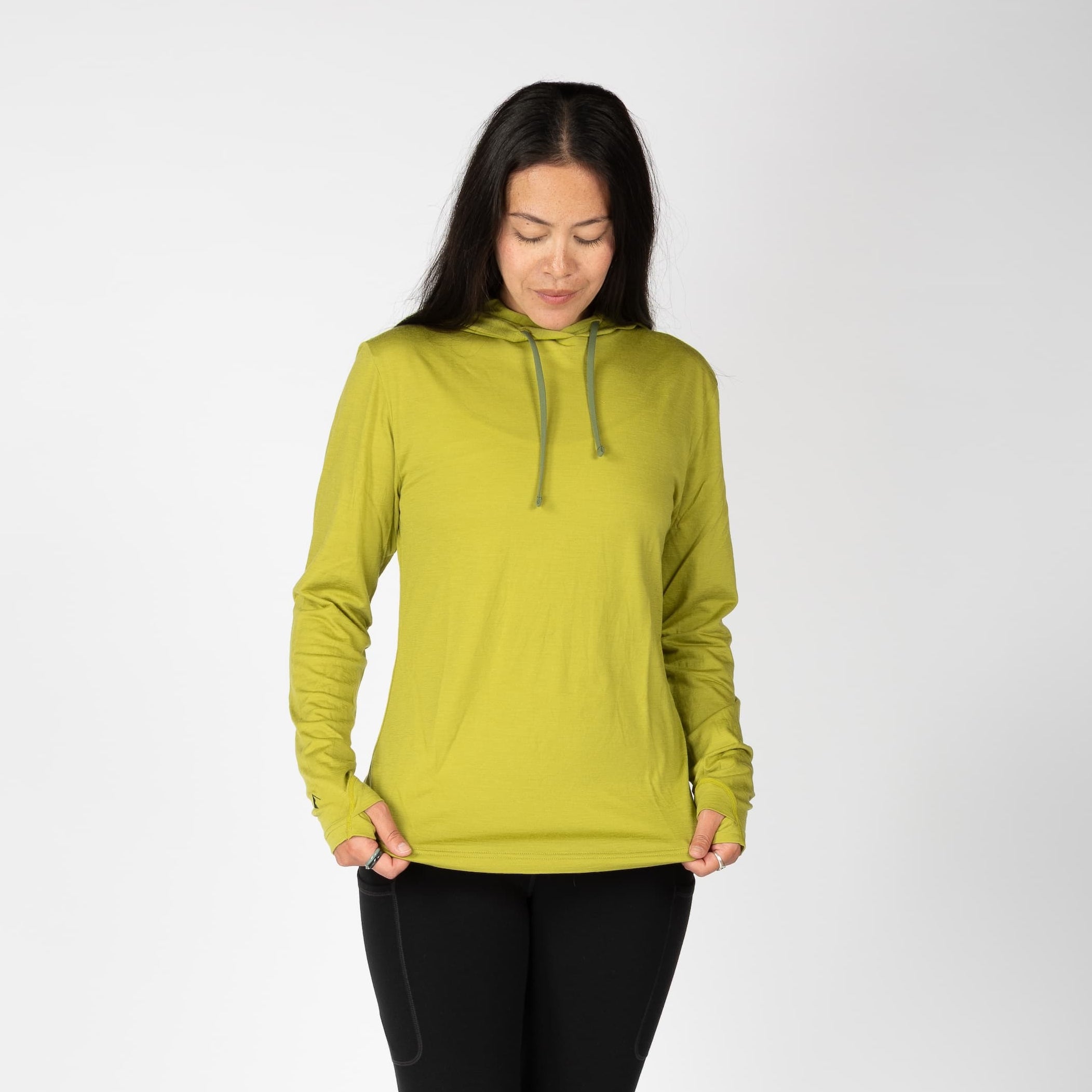 a woman wearing a Golden Lime Solstice Sun Hoodie