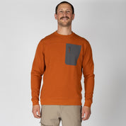 a man wearing a Cinnamon Cloudripper Crew Pullover with tan hiking pants