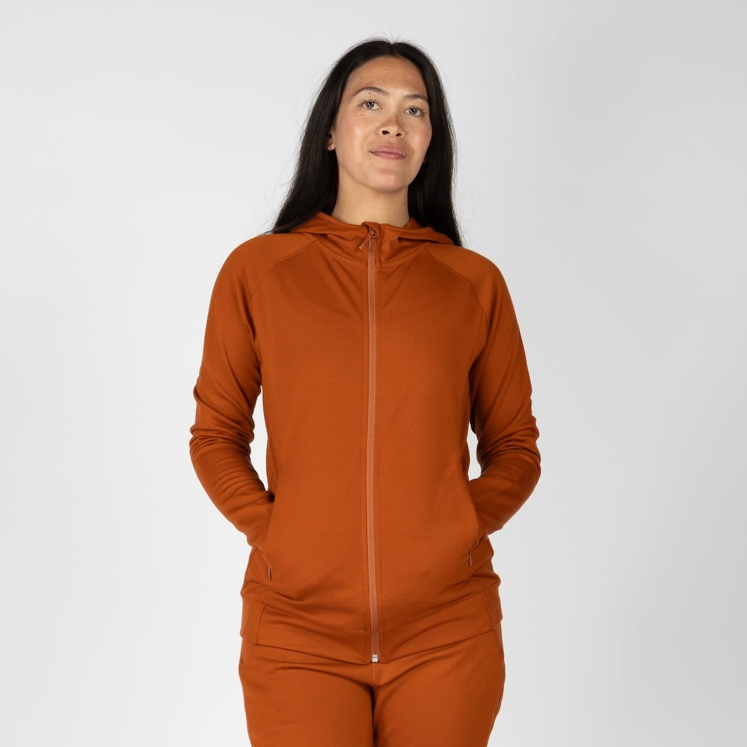a woman wearing a Cinnamon Hyde 100% Merino Wool Hoodie