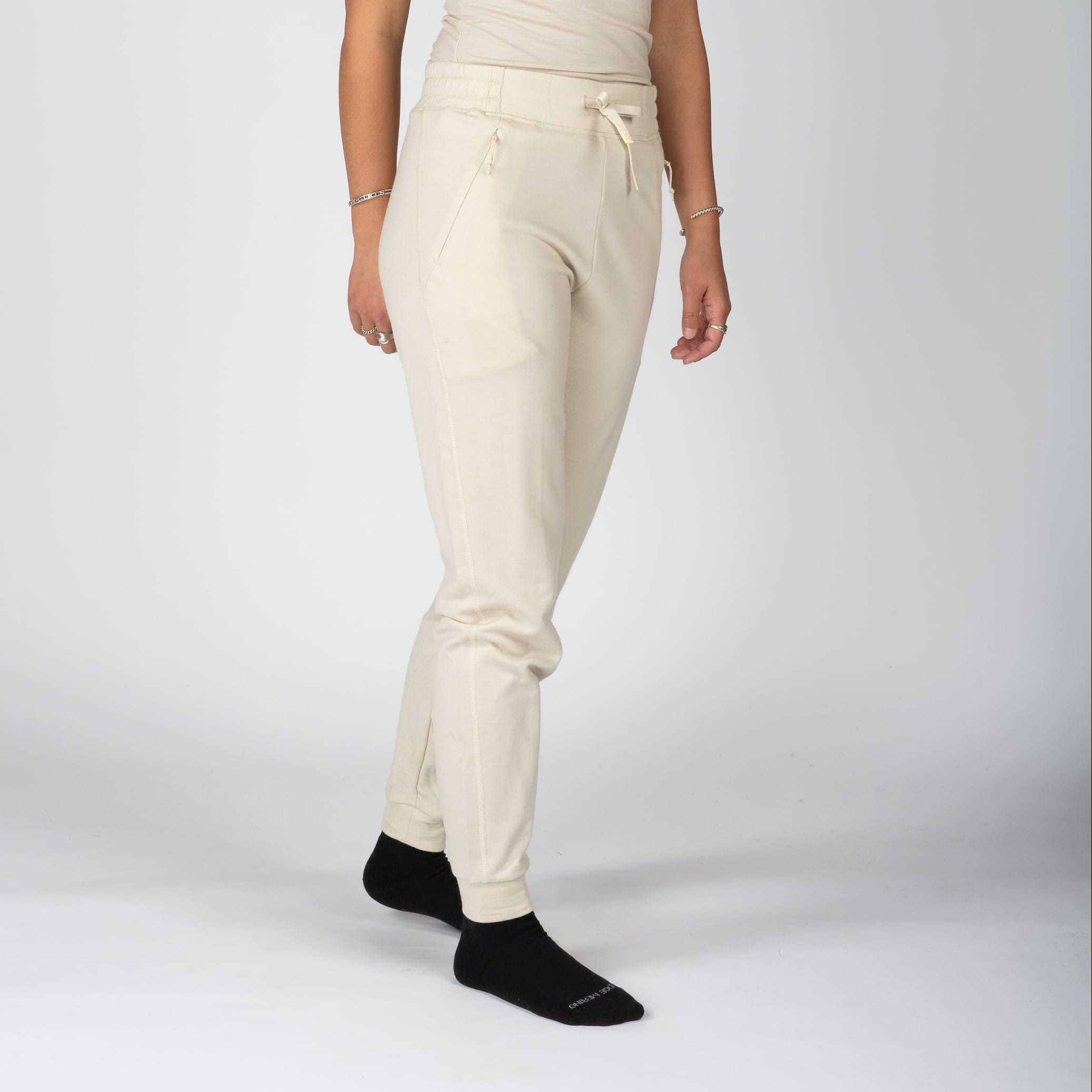 a woman wearing Sand 100% Merino wool Hyde Joggers