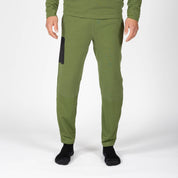 a man wearing green Cloudripper Grid Fleece Joggers
