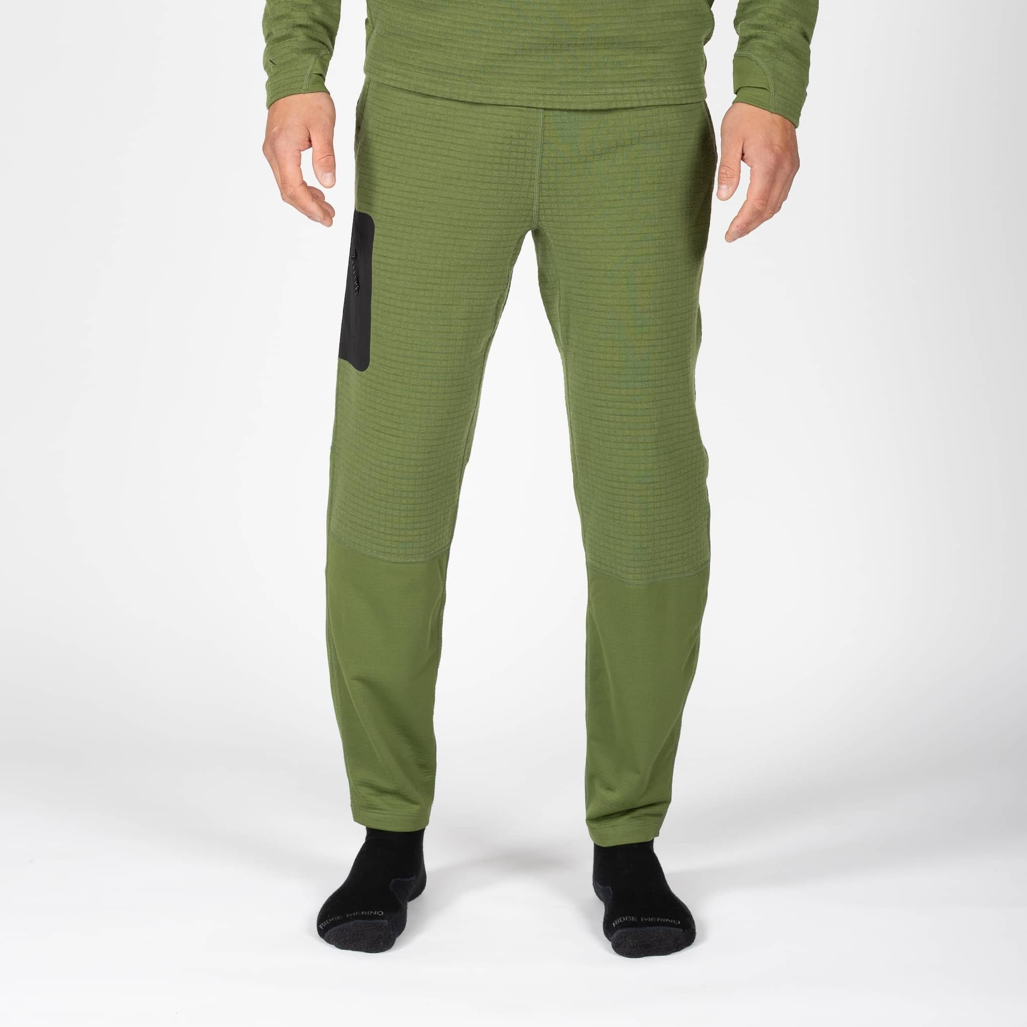 a man wearing green Cloudripper Grid Fleece Joggers