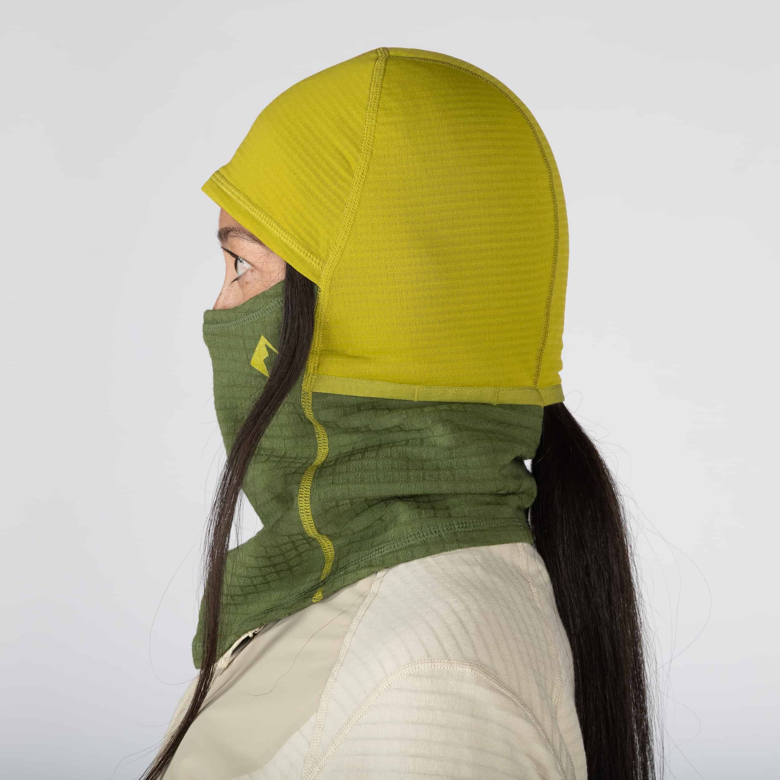 a woman wearing a Cloudripper Balaclava in Fern / Golden Lime with a Sand Cloudripper Fleece