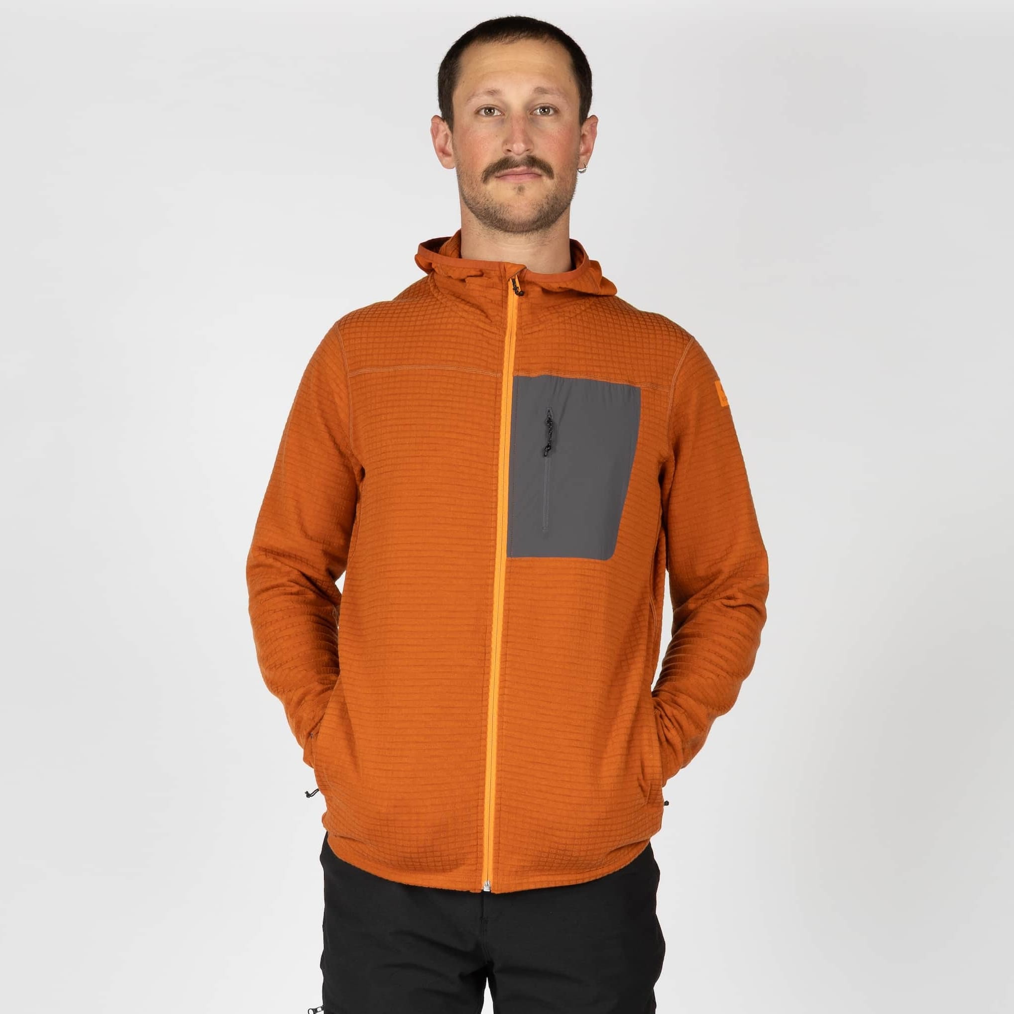 a man wearing a Cloudripper Full Zip Hoodie in Cinnamon