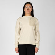 a woman wearing a Cloudripper Crew Pullover in Sand