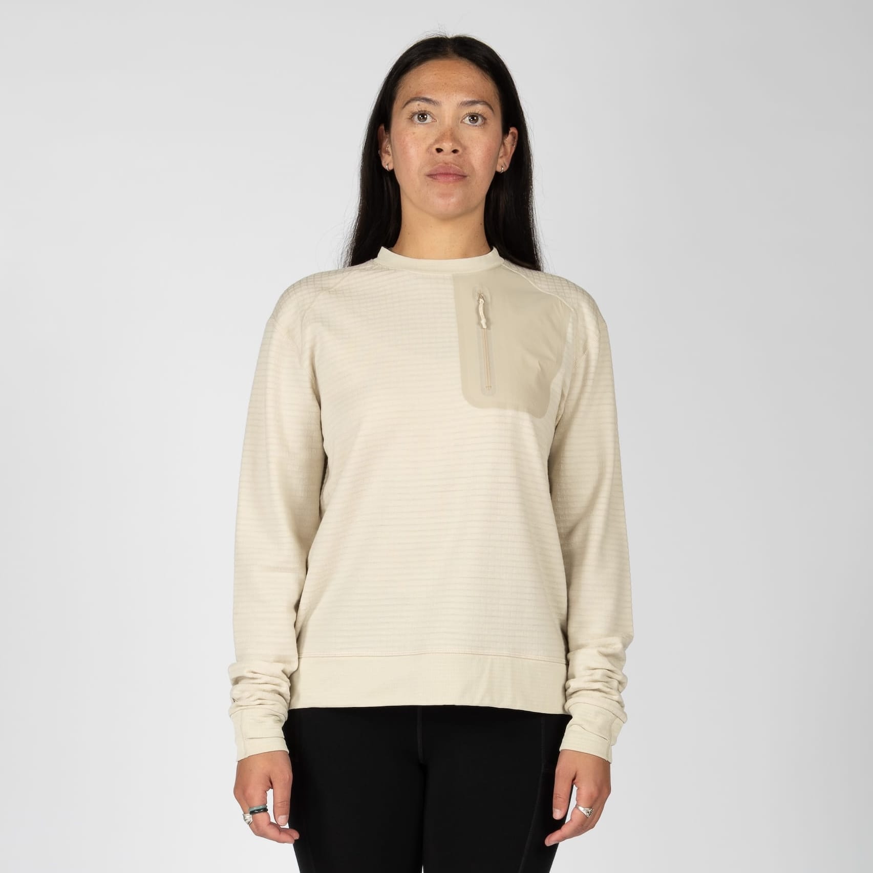 a woman wearing a Cloudripper Crew Pullover in Sand