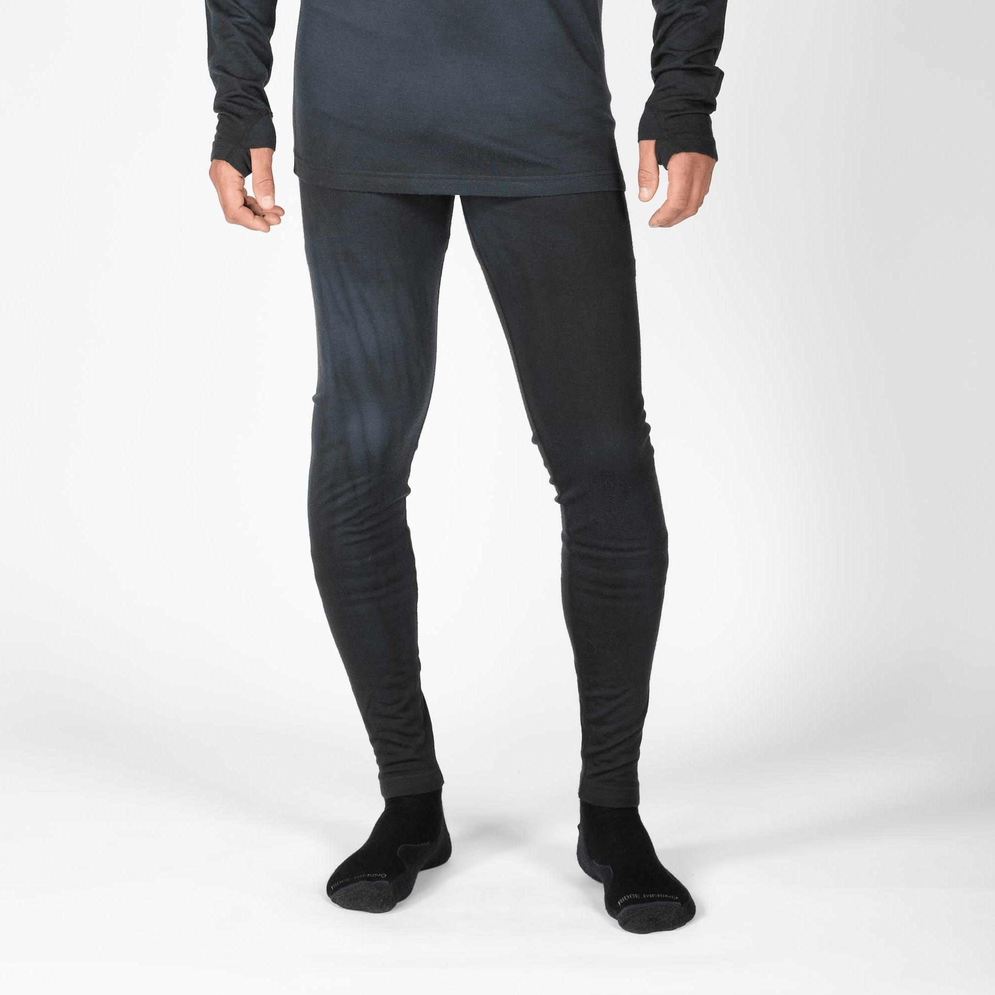 man wearing Aspect Merino Bottoms in Black Garment Dye