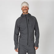 a man wearing a Charcoal Heather Hyde Hoodie with matching joggers and a Bone beanie