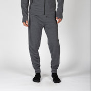 a man wearing gray 100% Merino wool joggers with a matching hoodie