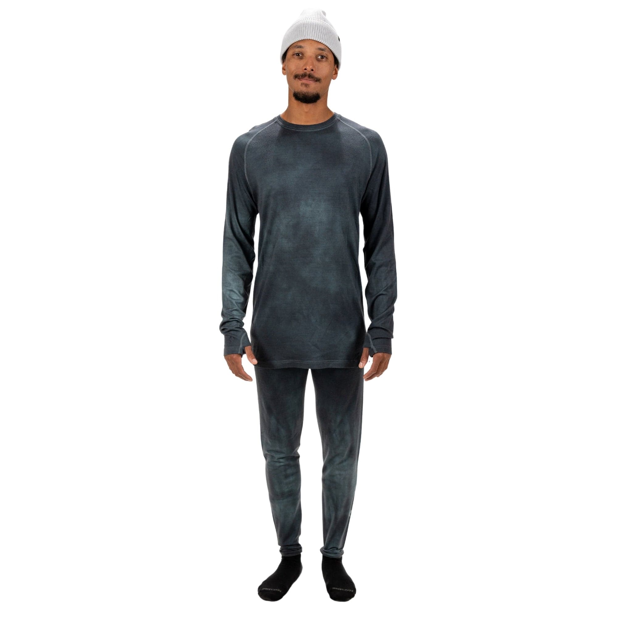 Men's Aspect Merino Wool Base Layer Long Sleeve on a studio model with matching Aspect Bottoms