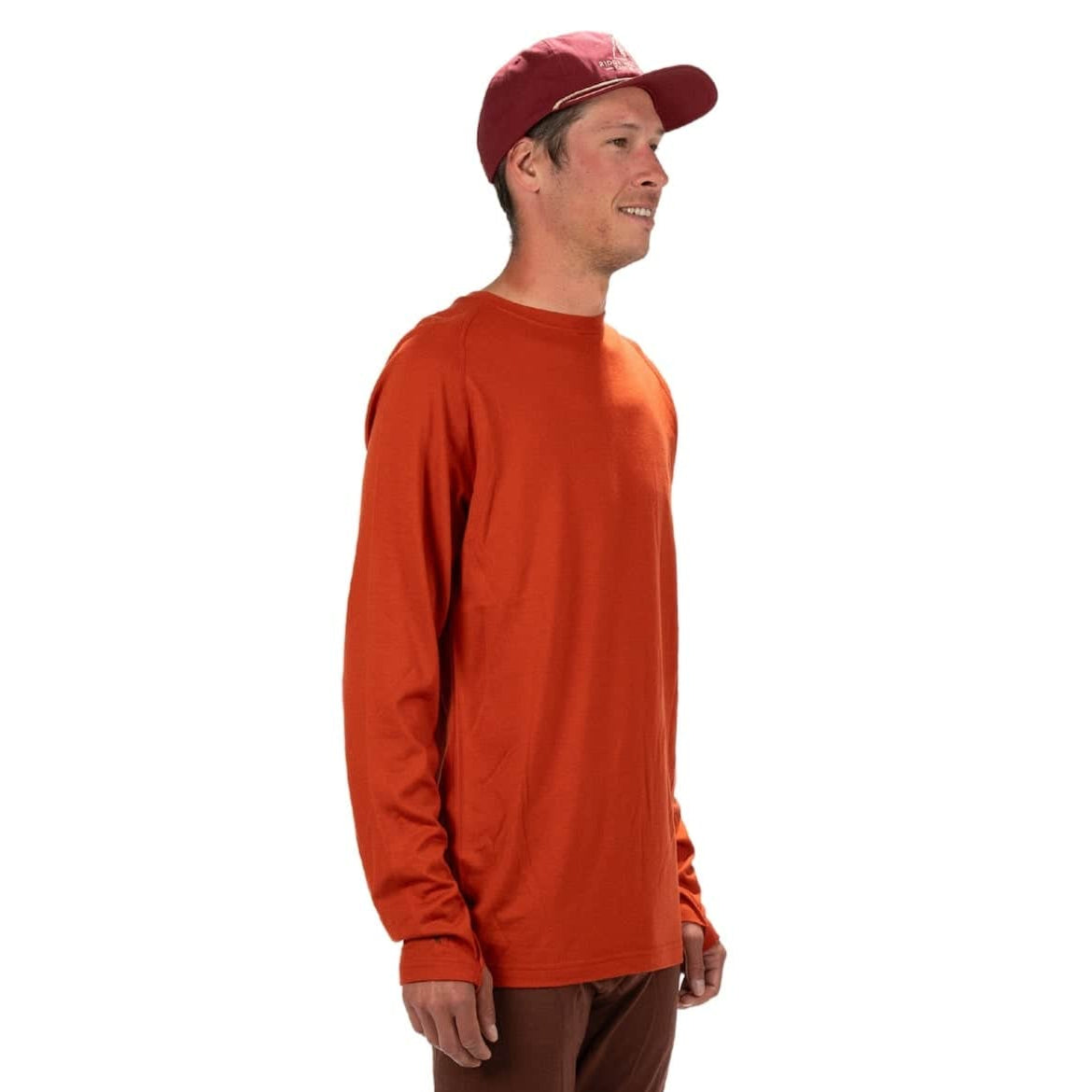 a man wearing an Aspect Base Layer Shirt and a ball cap