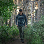 a hiker wearing a Ridge Merino wool sun hoodie