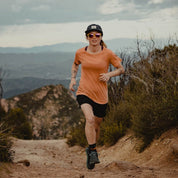 a woman trail running in Malibu wearing the Wander Crew Neck T-Shirt