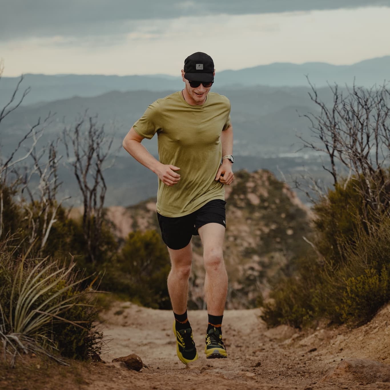 a man running in a Sage Journey Tee