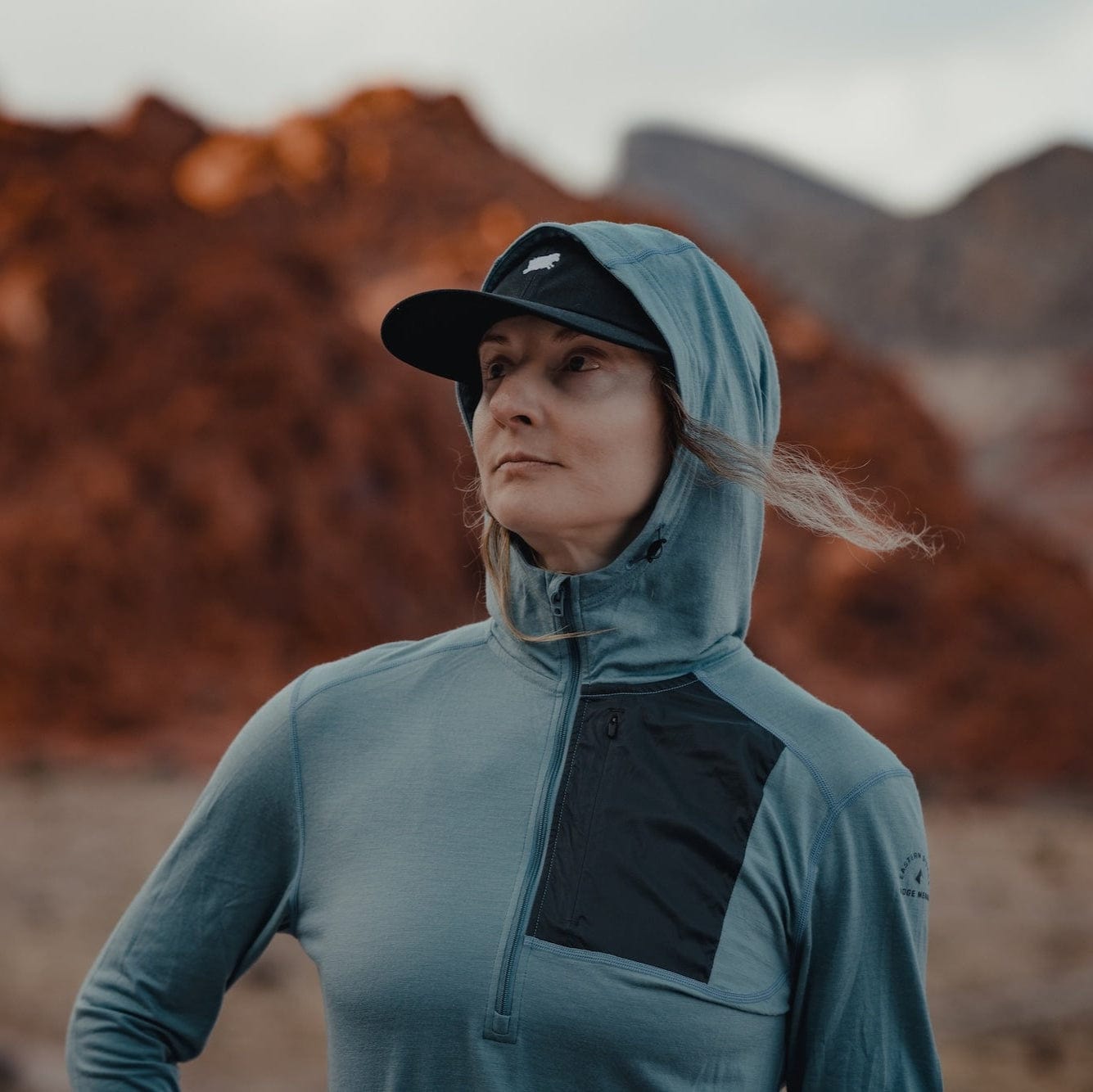a woman wearing a Solstice Pro Hoodie