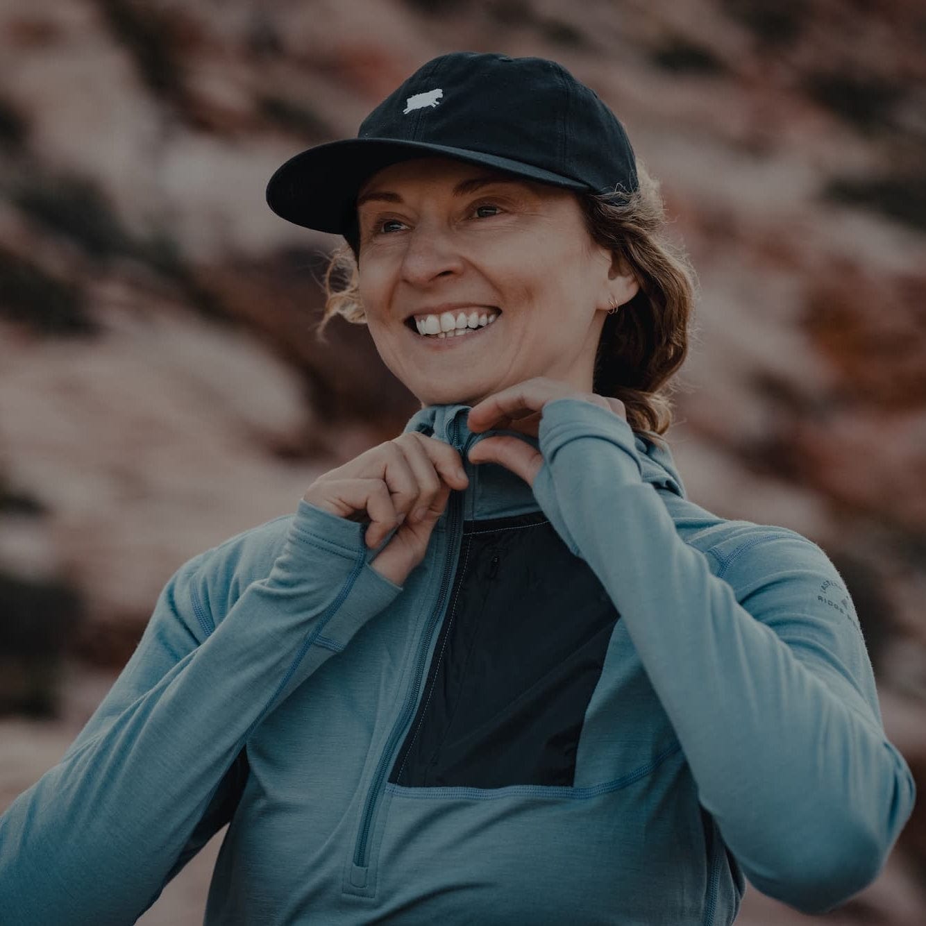 a woman wearing a Solstice Pro Sun Hoodie