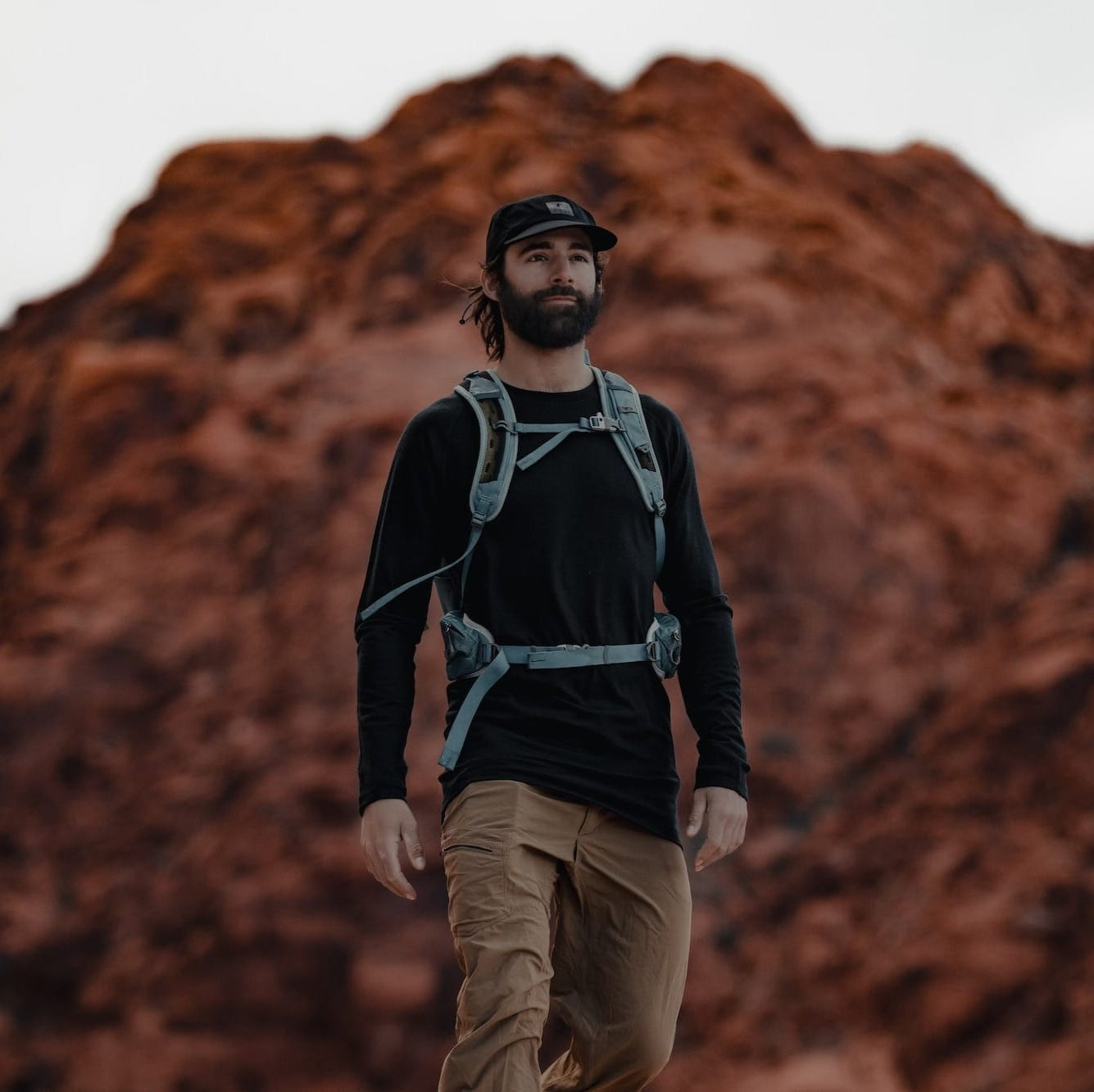 a man hiking wearing an Aspect Crew Top