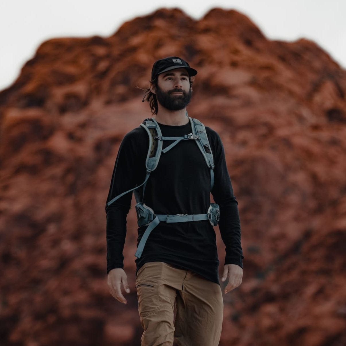 a man hiking in an Aspect Base Layer Shirt