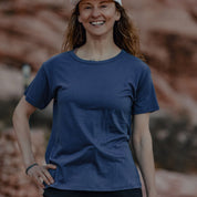 A woman wearing a Wander Relaxed Fit Tee in Vintage Indigo
