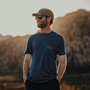 a man wearing a Ridge Merino graphic Journey Pocket Tee