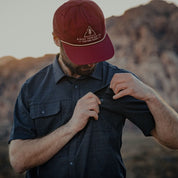 a man showing the pocket of the High Country Button Down Short Sleeve