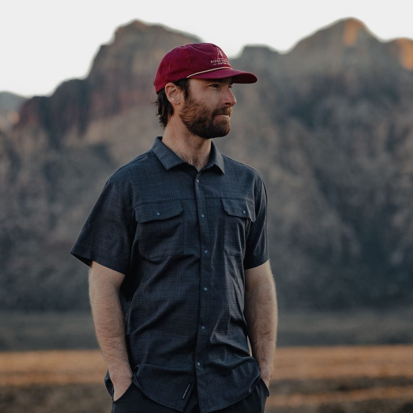 a man wearing the High Country Button Down Short Sleeve