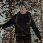 a man ski touring in a black Hyde Merino Wool Hoodie