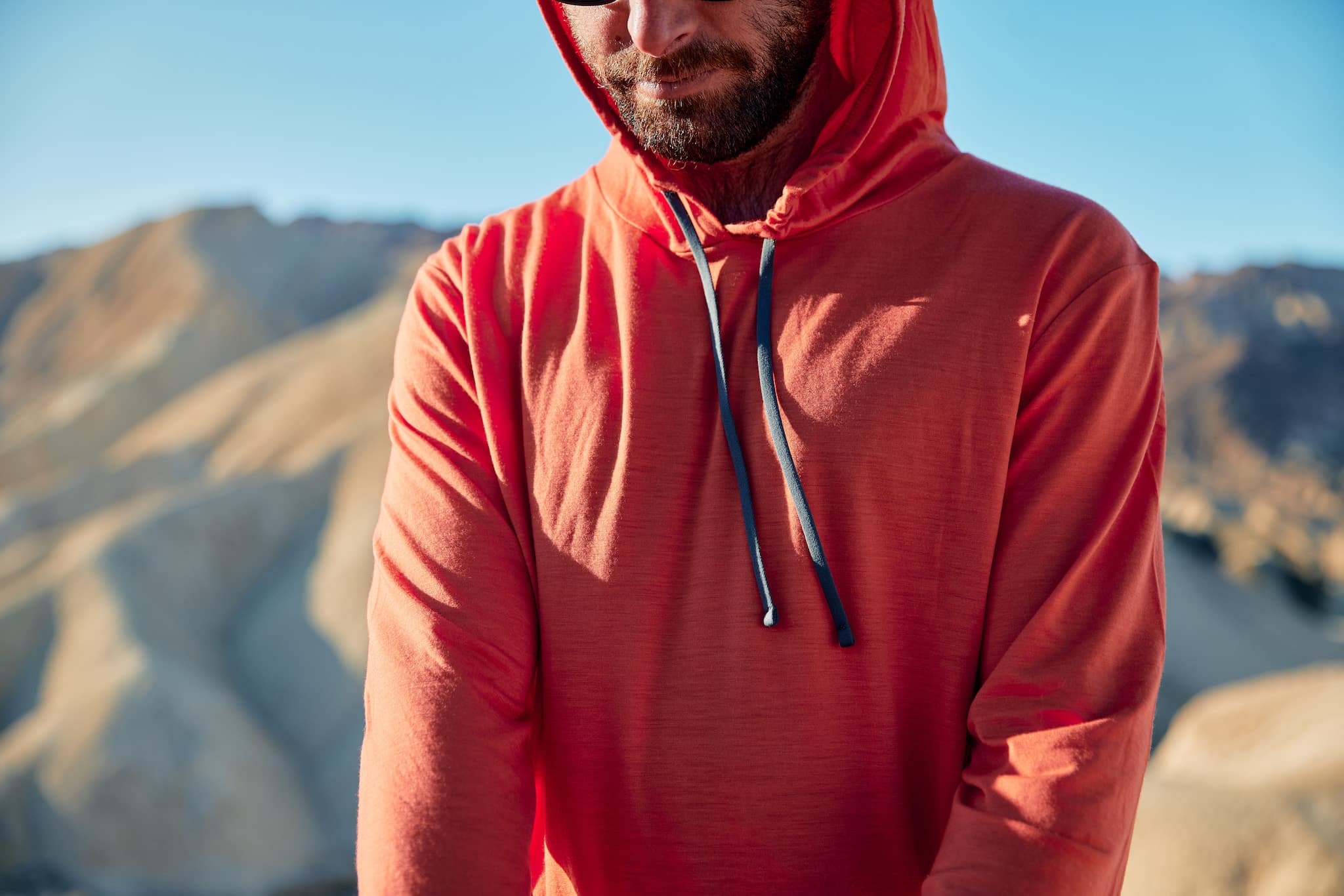 A close-up shot of a red Solstice hoodie