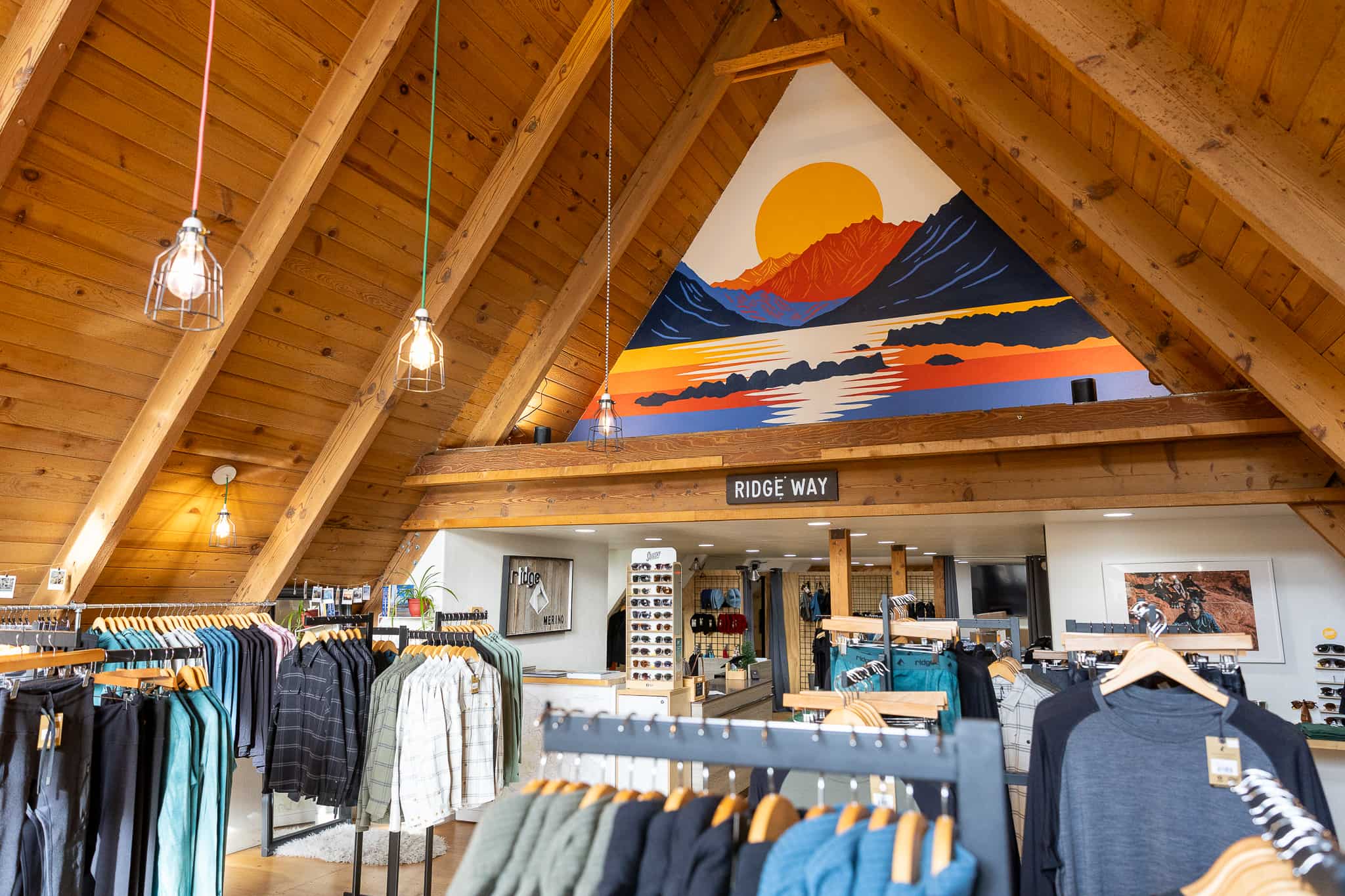 the interior of Ridge Merino's store in Mammoth Lakes, CA with a mural of Convict Lake in the top of the a-frame building