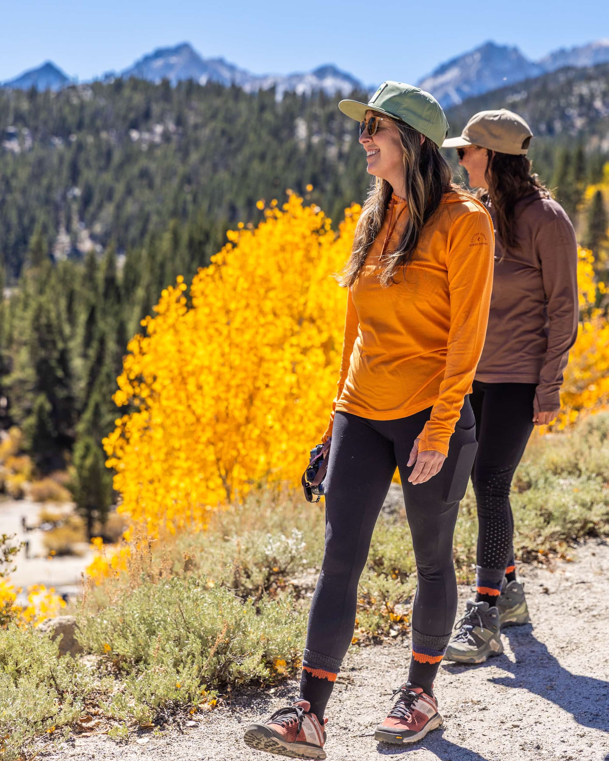 women hiking on a trail in Solstice Sun Hoodies