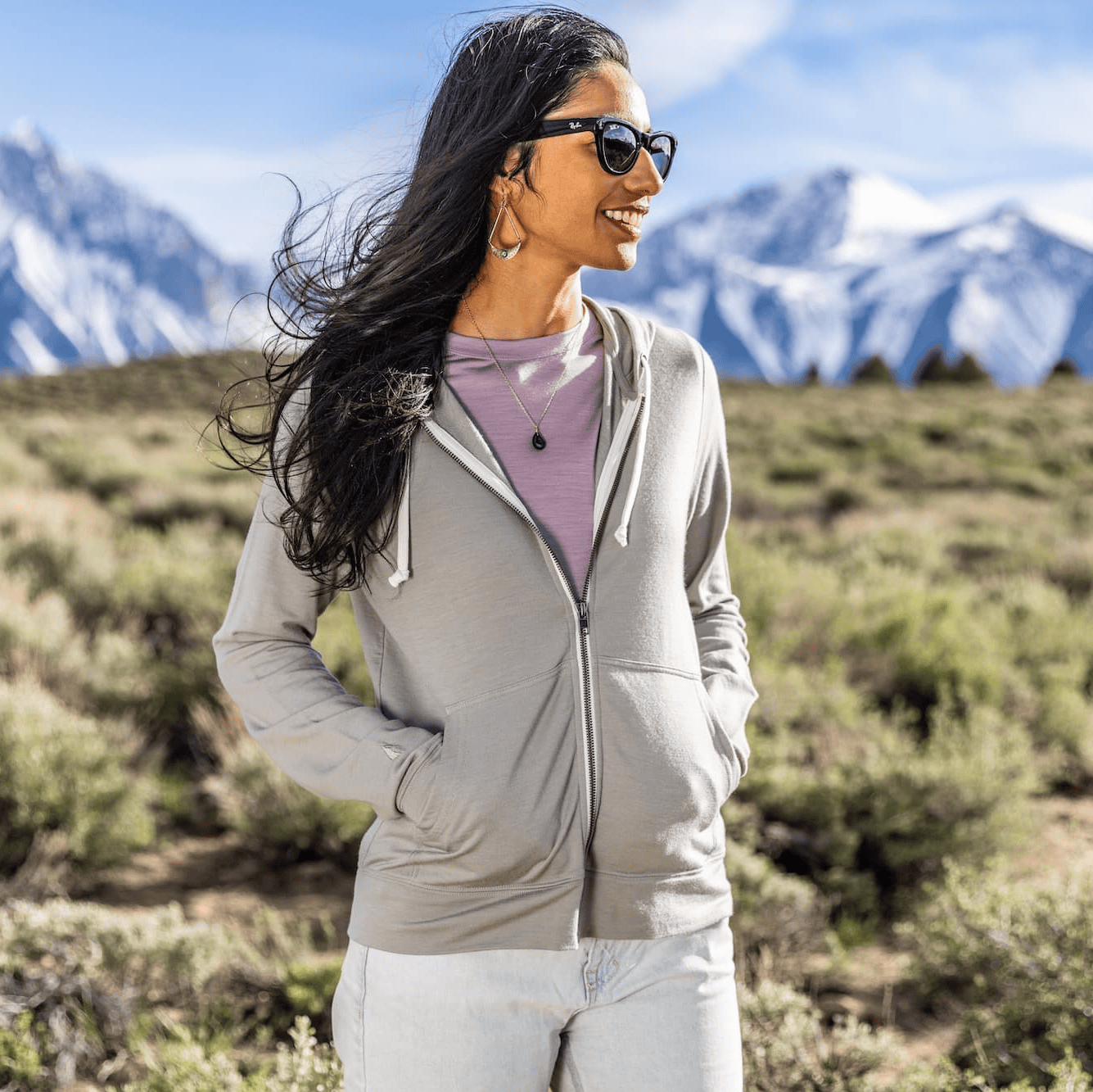 a woman wearing a Rock Ridge Traveler Hoodie over a Canopy T-Shirt in the mountains near Mammoth Lakes CA