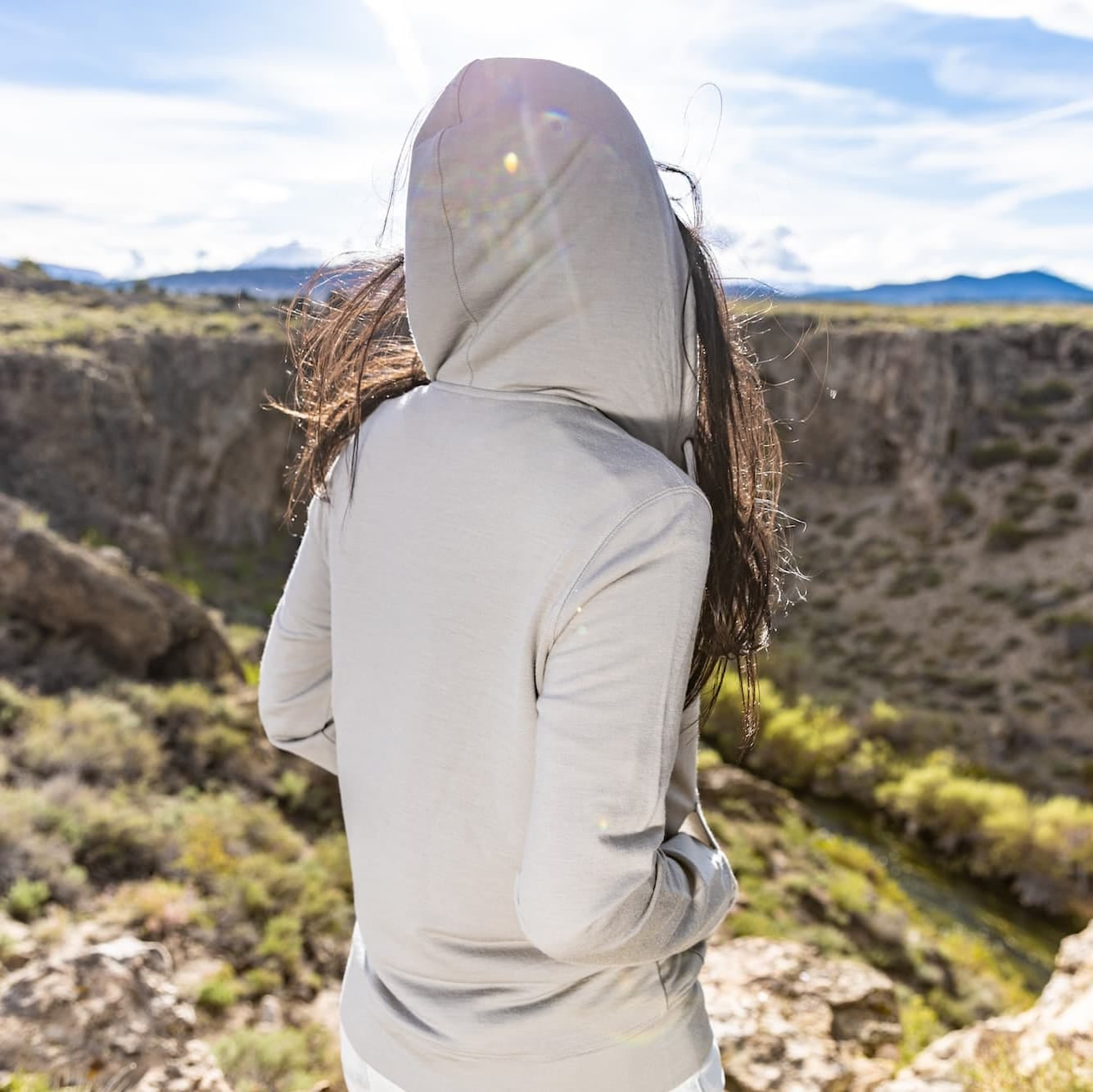 the Traveler Hoodie from the back with the hood up