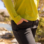 a closeup of the arm logo/detail on the Ridge Merino Wool Solstice Sun Hoodie